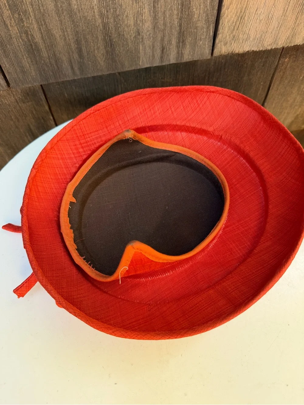 Vintage 1960s saucer style hat rusty orange fabric bow size OS no label.
